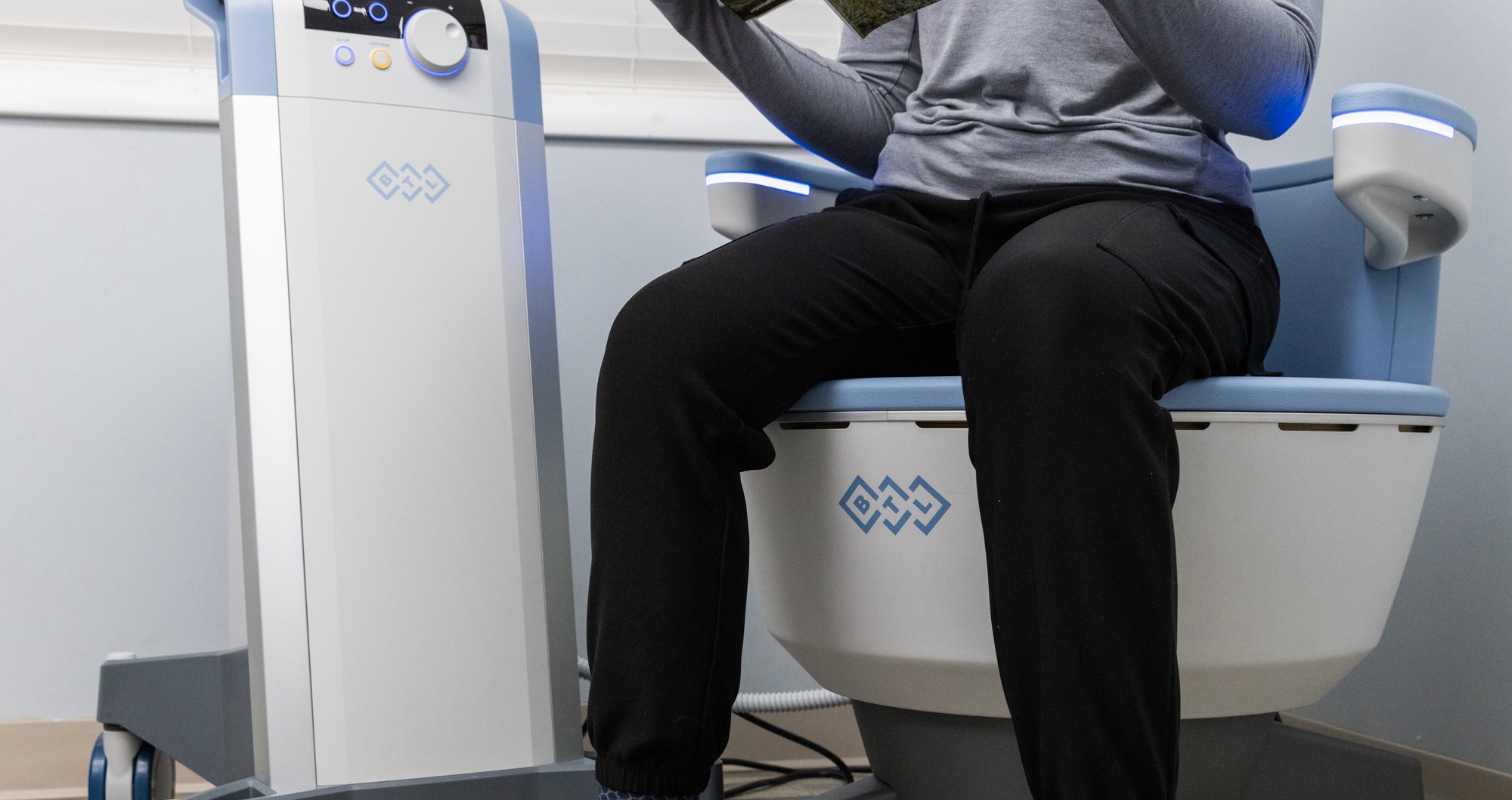 The lower half of a woman as she sits on the Emsella chair, getting treatment for pelvic floor hypertonicity in Frisco.