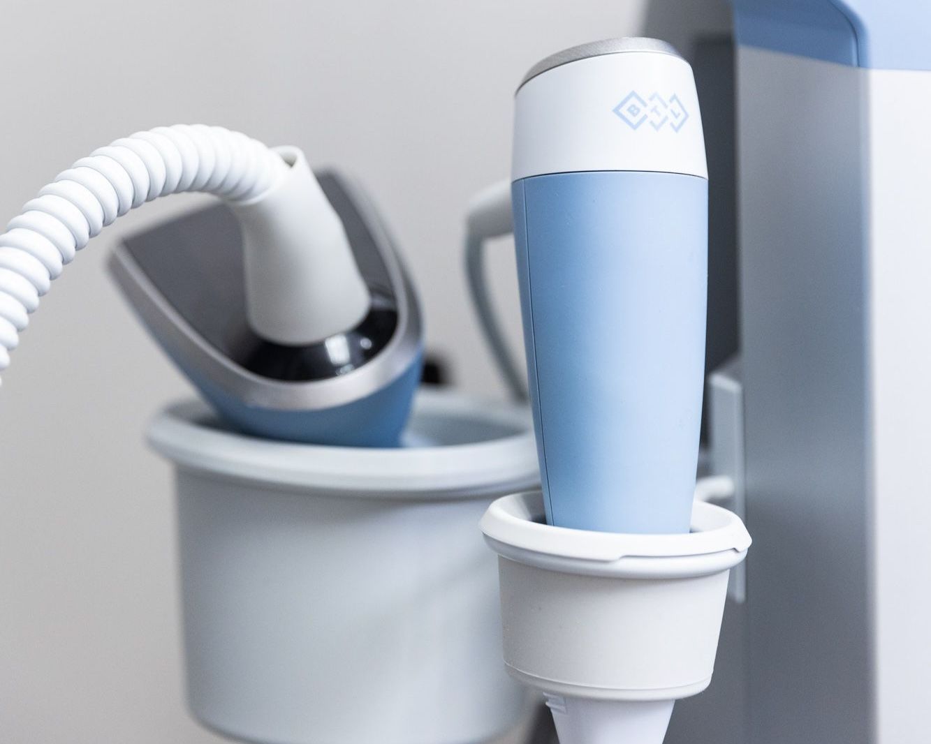 A blue and white machine that tightens skin using technology for RF microneedling near Plano.